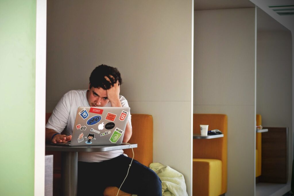 Frustrated man working hard to meet expectations